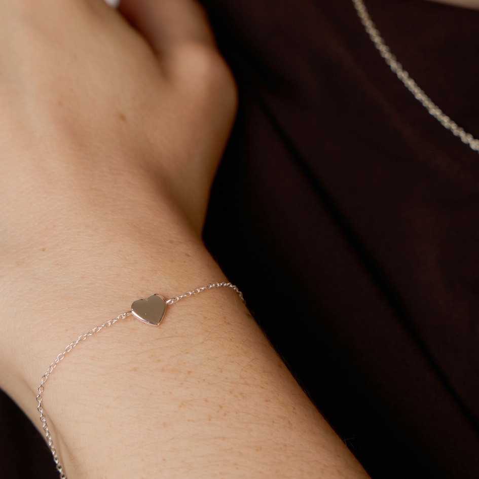 women with bracelet silver heart