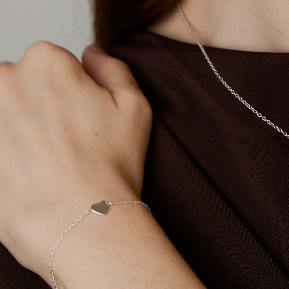 women with bracelet silver heart