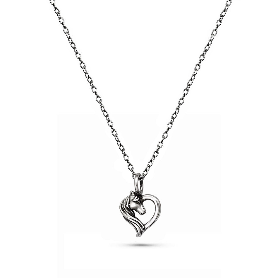 Sterling silver necklace with small horse and heart pendant, close-up on white background.